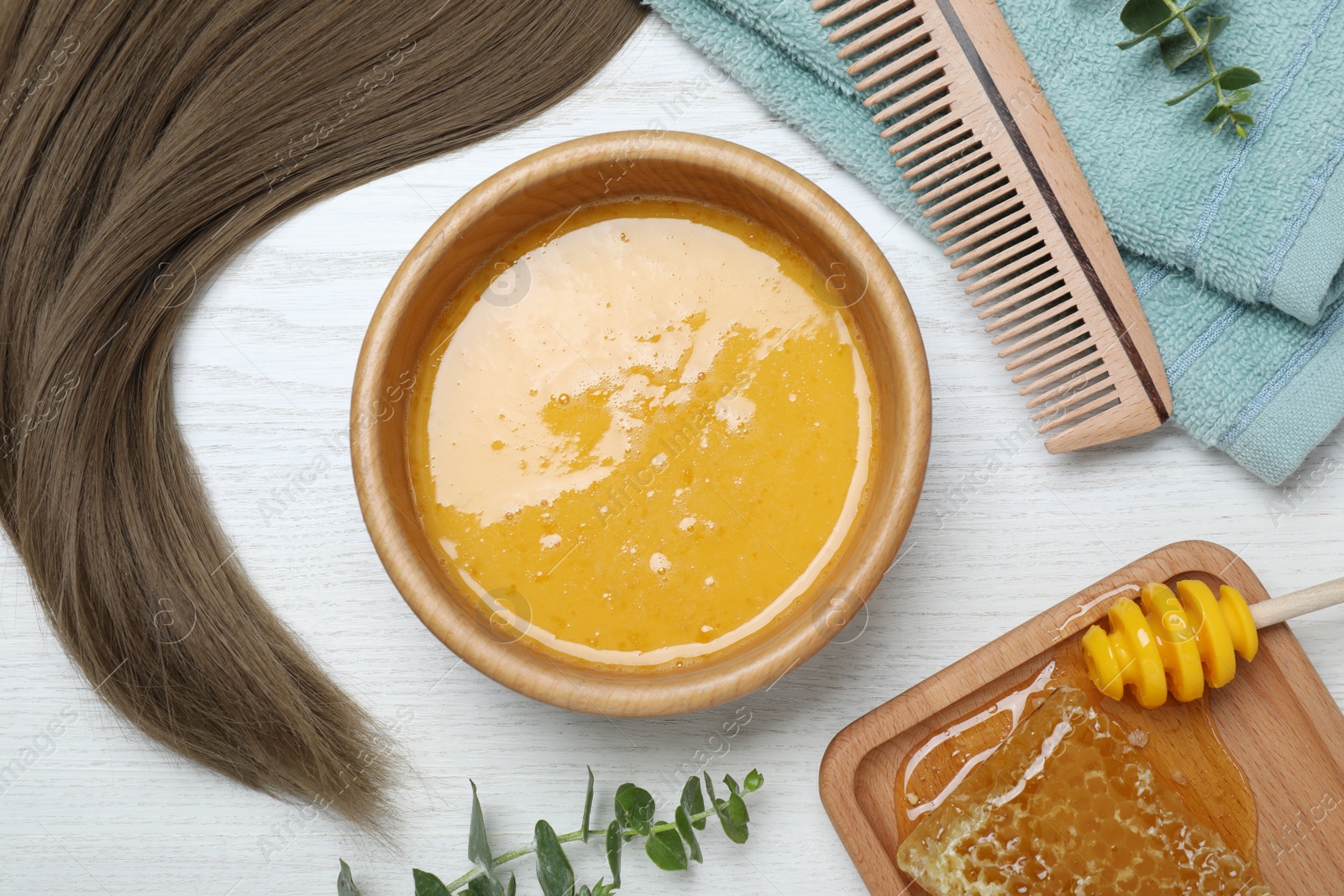 Photo of Flat lay composition with homemade hair mask in bowl on white wooden table