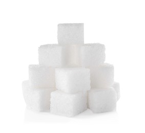 Photo of Pile of sugar cubes on white background