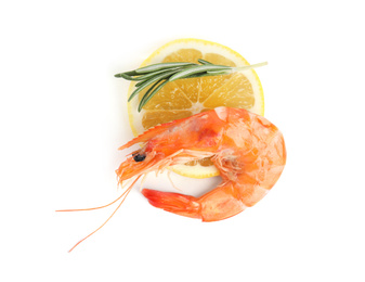Photo of Delicious cooked shrimp, lemon and rosemary isolated on white, top view