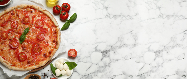 Image of Top viewhot delicious pizza on light marble table, space for text. Banner design 