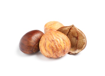 Photo of Fresh sweet edible chestnuts on white background