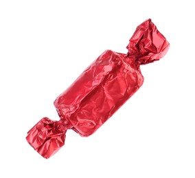 Tasty candy in red wrapper isolated on white