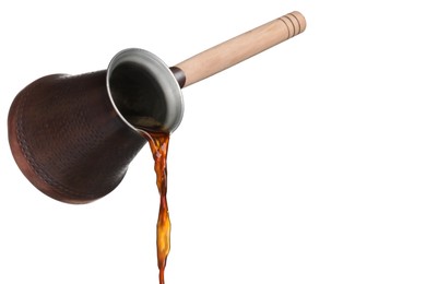 Photo of Pouring hot coffee from turkish pot on white background