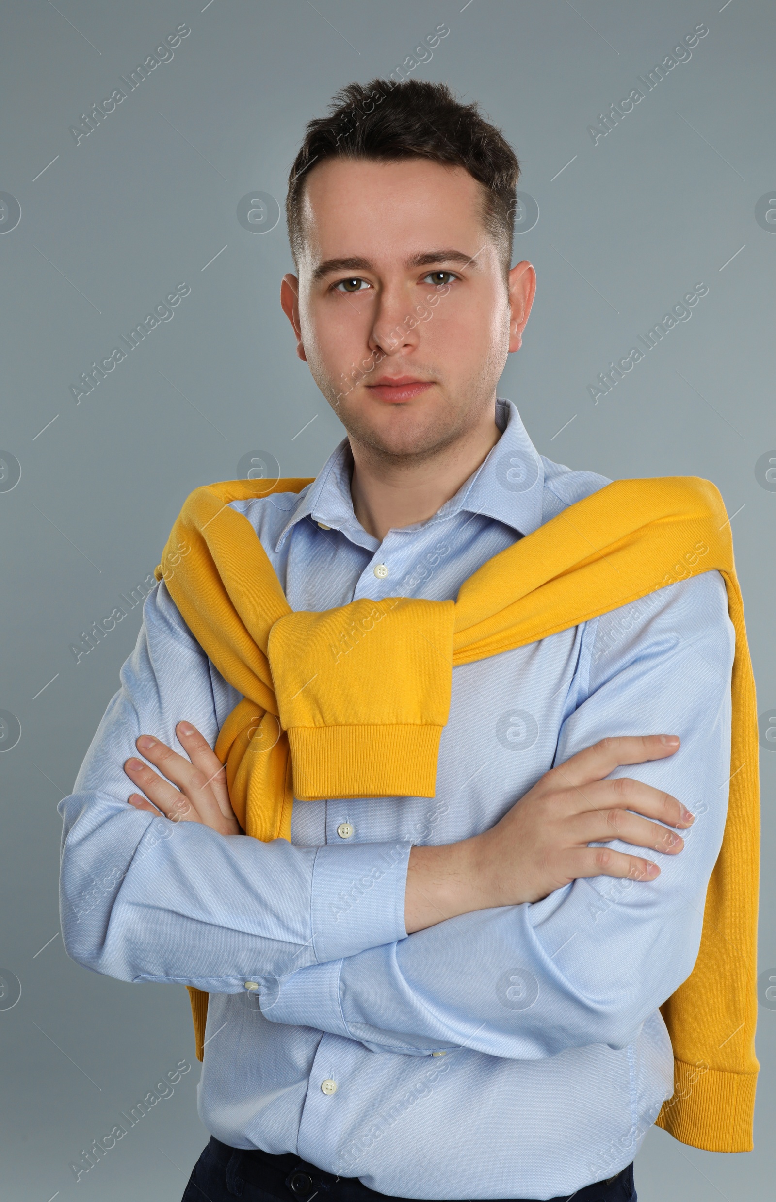 Photo of Portrait of young man on grey background