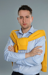 Photo of Portrait of young man on grey background