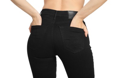 Photo of Woman wearing stylish black jeans on white background, closeup