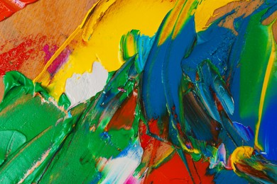 Photo of Abstract colorful acrylic paint as background, top view