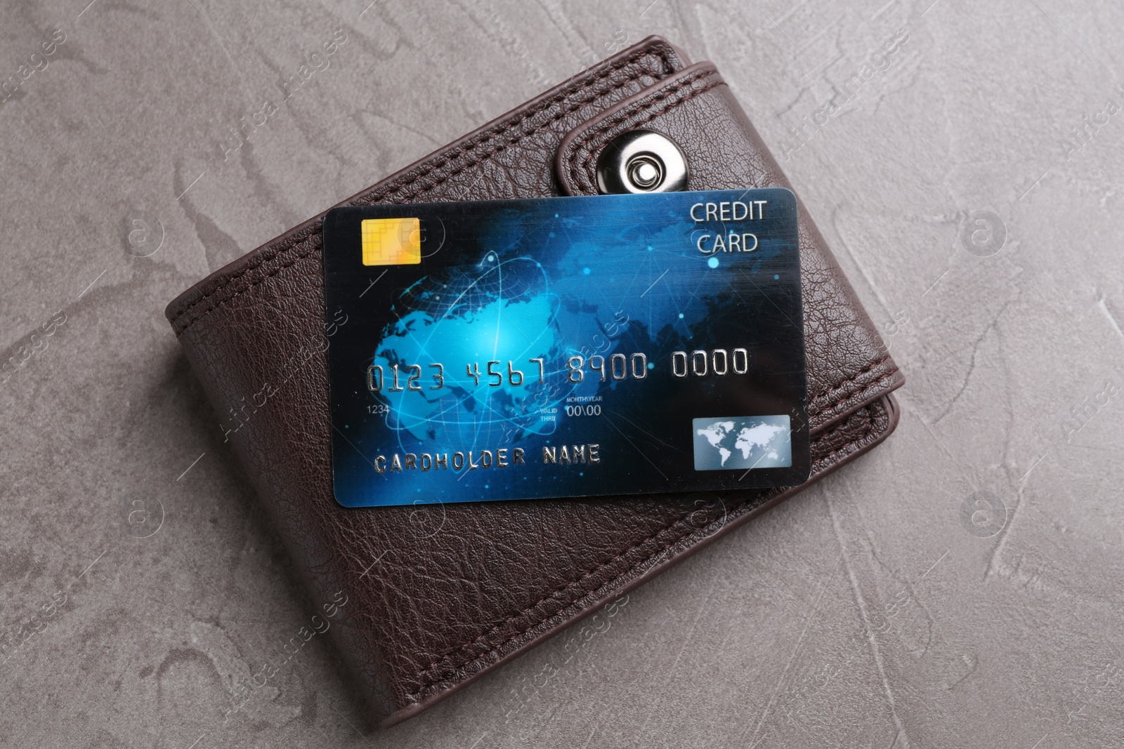 Photo of Credit card and leather wallet on grey textured table, top view