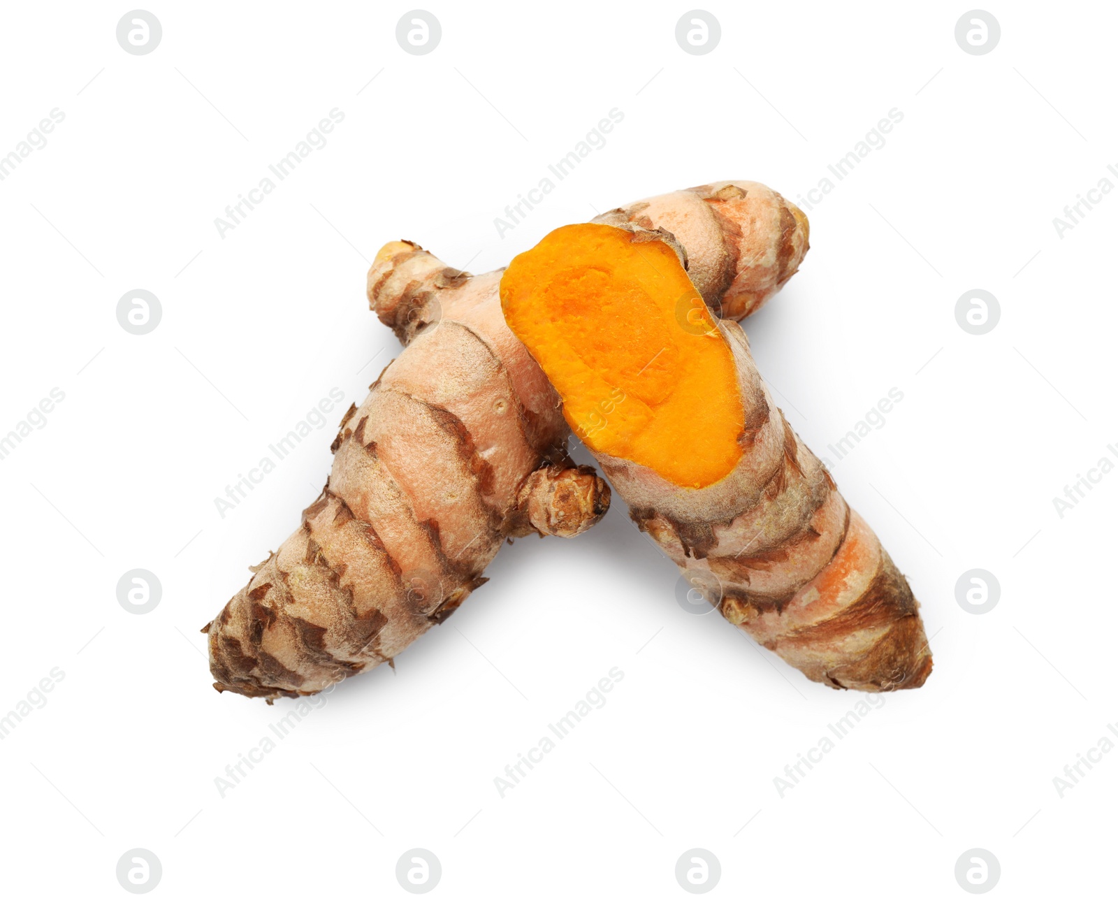 Photo of Fresh whole and cut turmeric roots isolated on white, top view