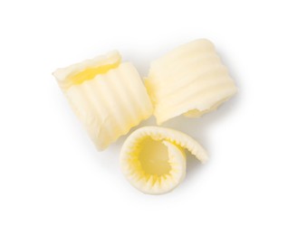 Fresh tasty butter curls isolated on white, top view