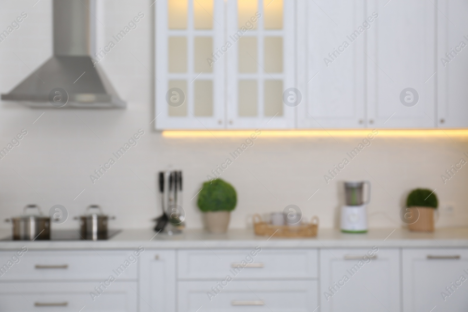 Photo of Blurred view of modern stylish kitchen interior