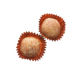 Delicious chocolate candies on white background, top view