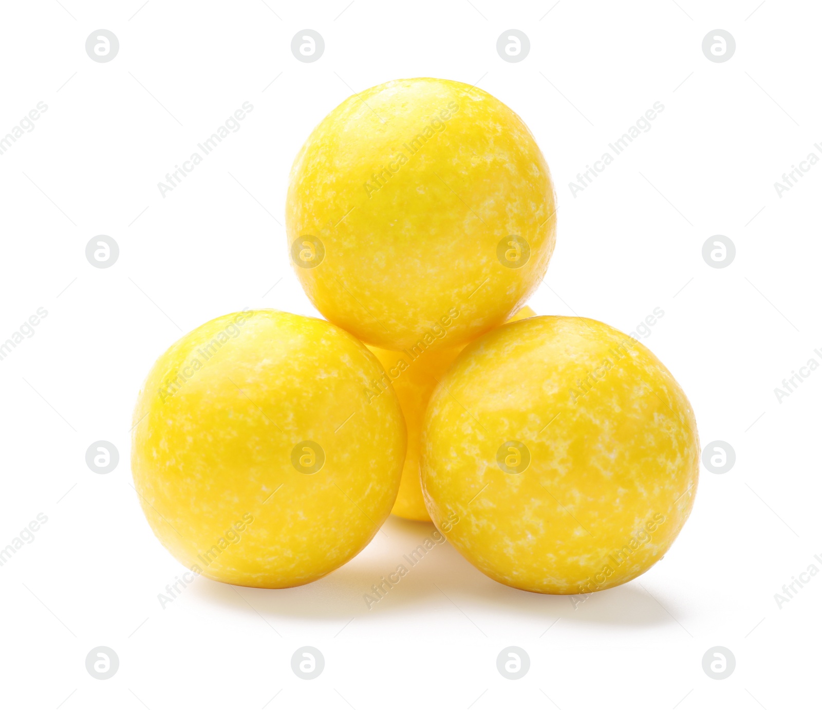 Photo of Tasty small lemon drops isolated on white