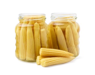 Jars and pickled baby corn isolated on white