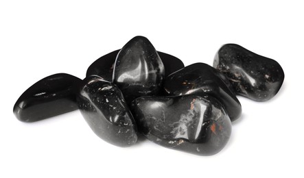 Photo of Many black spa stones on white background