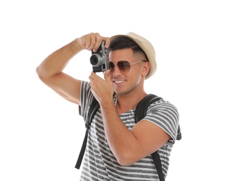 Man with straw hat taking picture on white background. Summer travel