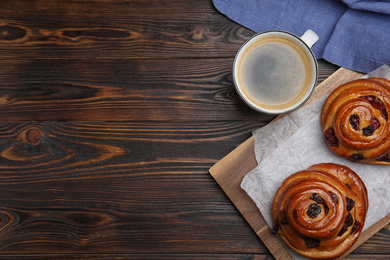 Photo of Delicious pastries and coffee on wooden table, flat lay. Space for text