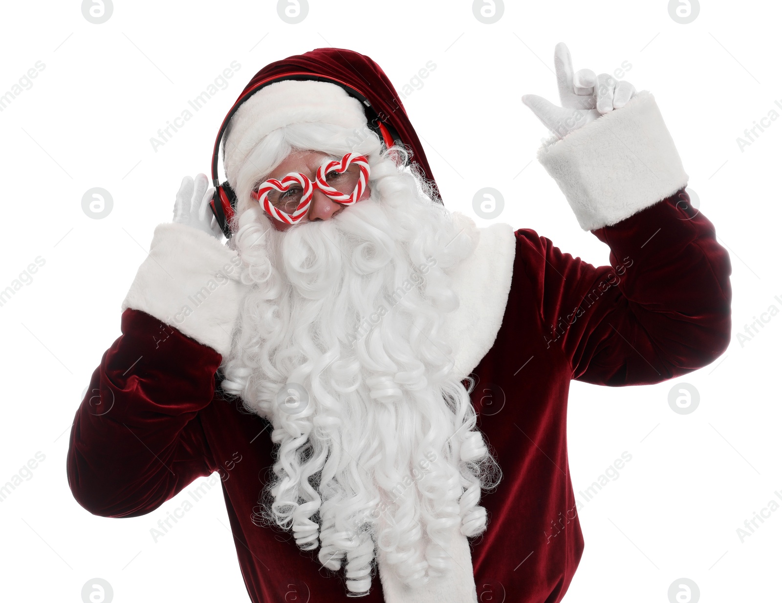 Photo of Santa Claus with headphones listening to Christmas music on white background