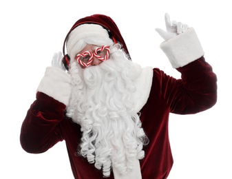 Santa Claus with headphones listening to Christmas music on white background