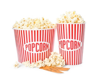 Photo of Buckets of fresh popcorn and tickets on white background. Cinema snack