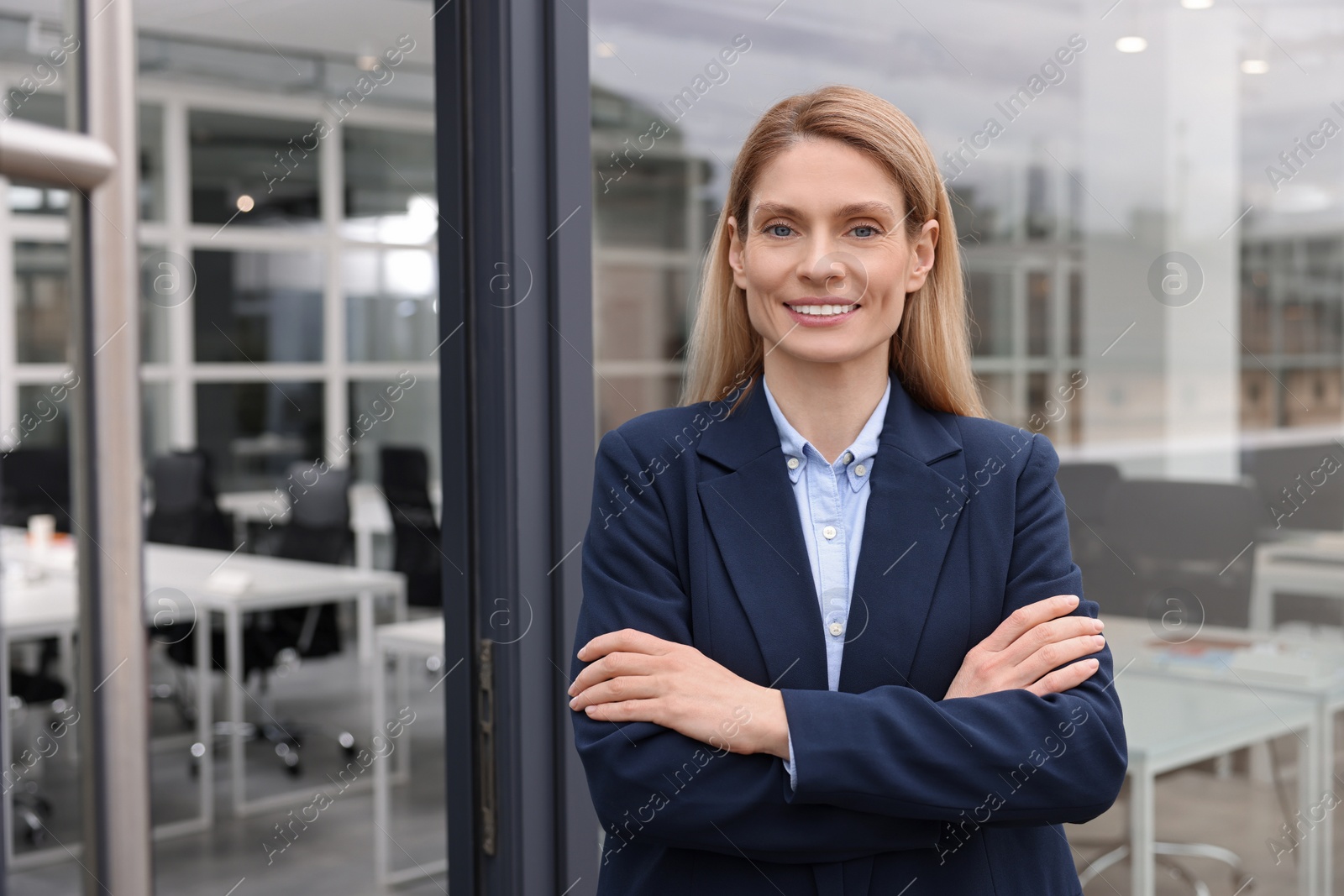 Photo of Happy real estate agent in suit near office outdoors. Space for text