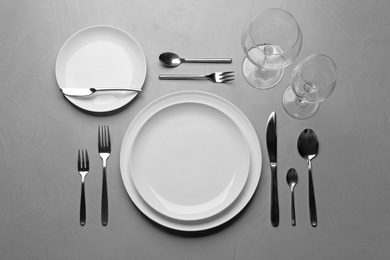 Photo of Elegant table setting on grey background, flat lay
