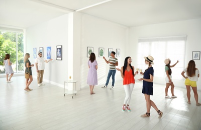 Photo of Group of people at exhibition in art gallery