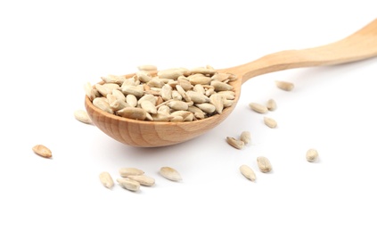 Photo of Peeled sunflower seeds in spoon on white background, closeup