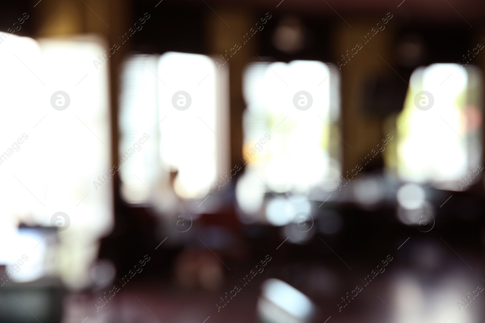 Photo of Blurred view of beer pub with stylish furniture