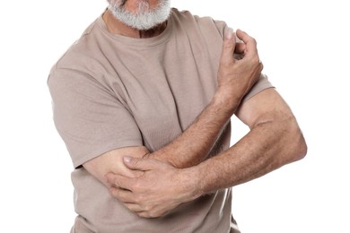 Photo of Senior man suffering from pain in elbow on white background, closeup. Arthritis symptoms