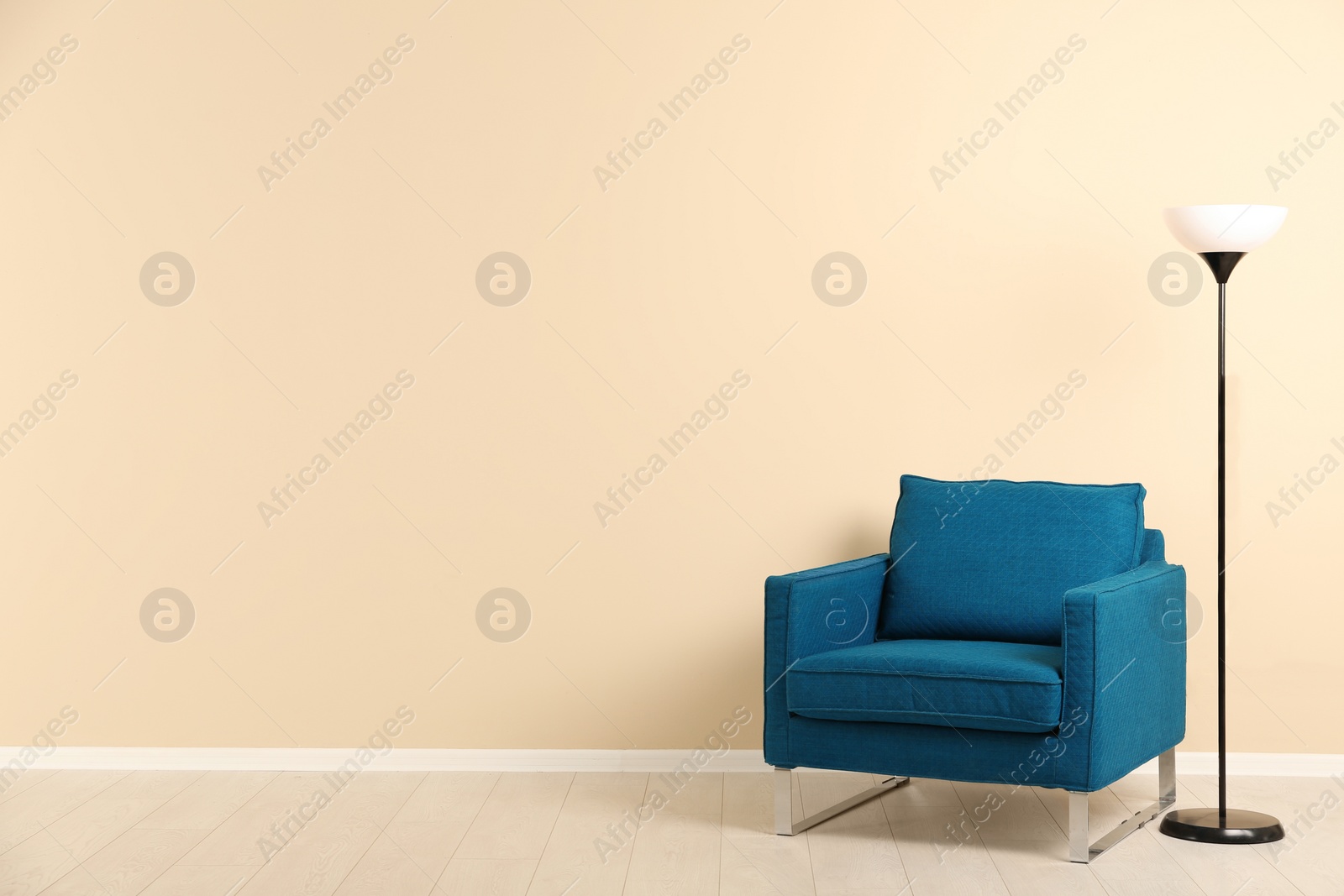 Photo of Stylish living room interior with comfortable armchair and space for text