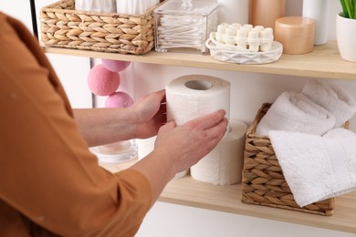 Photo of Bath accessories. Woman organizing personal care products indoors, closeup