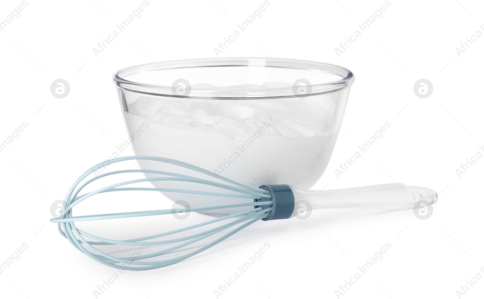 Photo of Bowl with whipped cream and whisk isolated on white