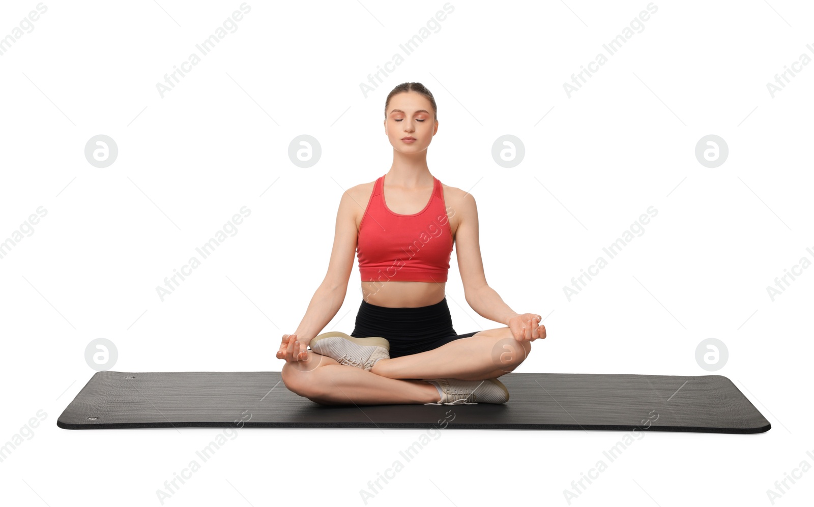 Photo of Young woman practicing yoga on white background