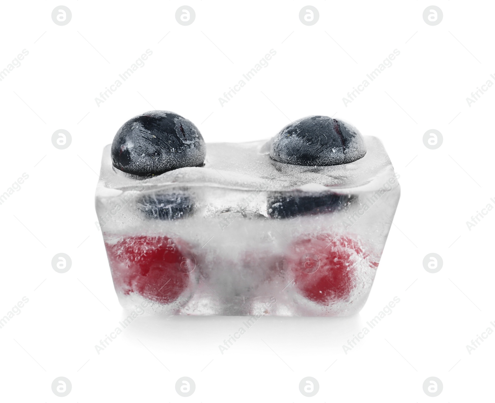 Photo of Raw berries frozen in ice cube on white background