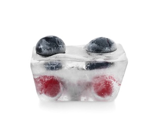 Photo of Raw berries frozen in ice cube on white background