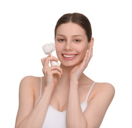 Photo of Washing face. Young woman with cleansing brush on white background