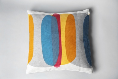 Soft decorative pillow on light background