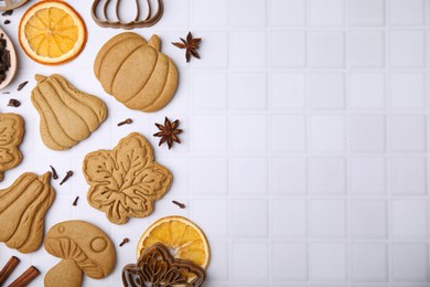 Photo of Flat lay composition with tasty cookies, spices and cutters on white table, space for text
