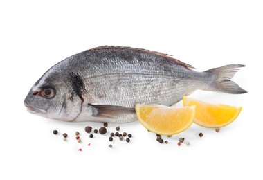 Photo of Raw dorado fish, lemon wedges and peppercorns isolated on white