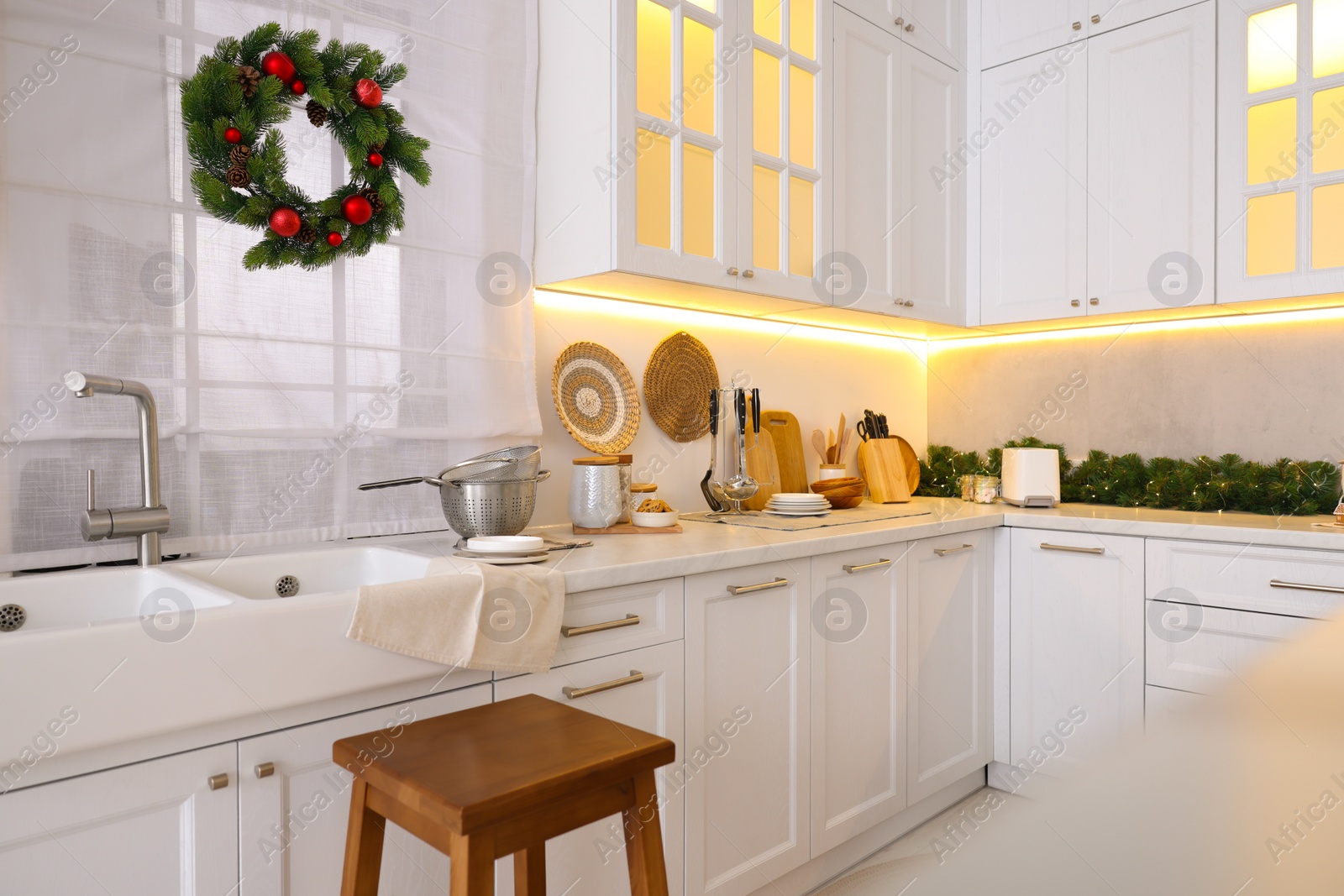 Photo of Cozy kitchen decorated for Christmas. Interior design