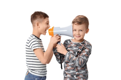 Photo of Little boy with megaphone shouting at his friend on white background