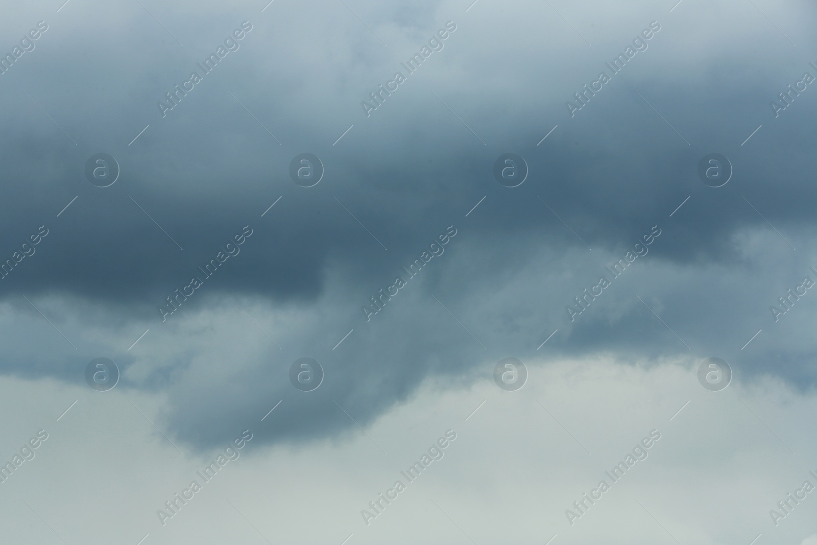 Photo of Sky with heavy rainy clouds on grey day