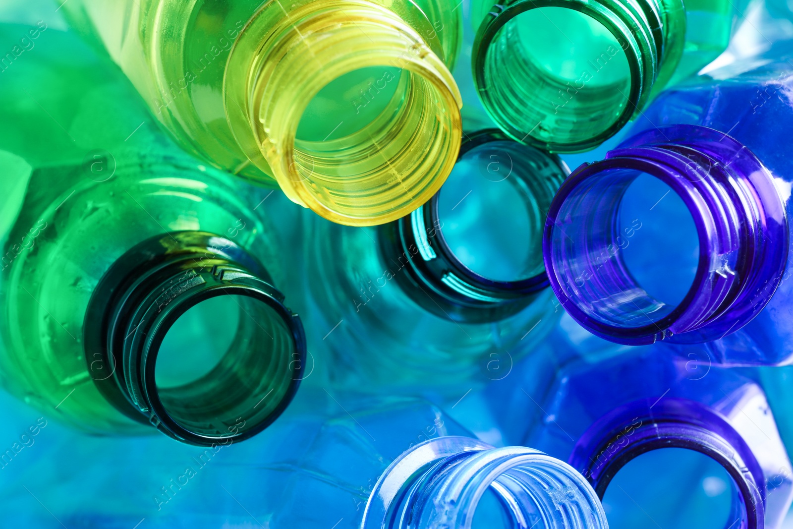 Photo of Used plastic bottles as background, closeup. Recycling problem