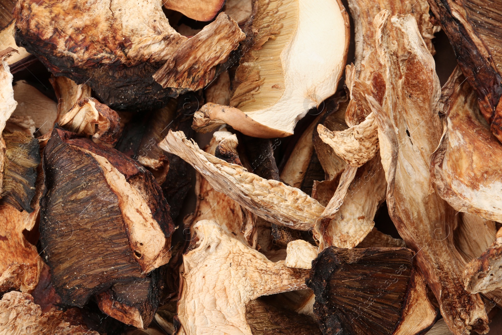 Photo of Delicious dried slices of mushrooms as background, closeup view