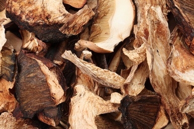 Photo of Delicious dried slices of mushrooms as background, closeup view