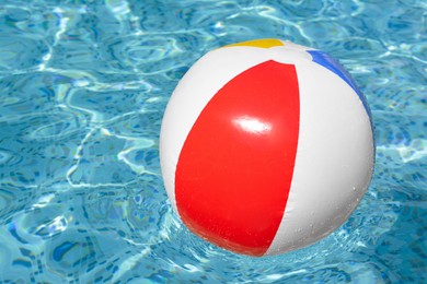 Photo of Inflatable beach ball floating in swimming pool