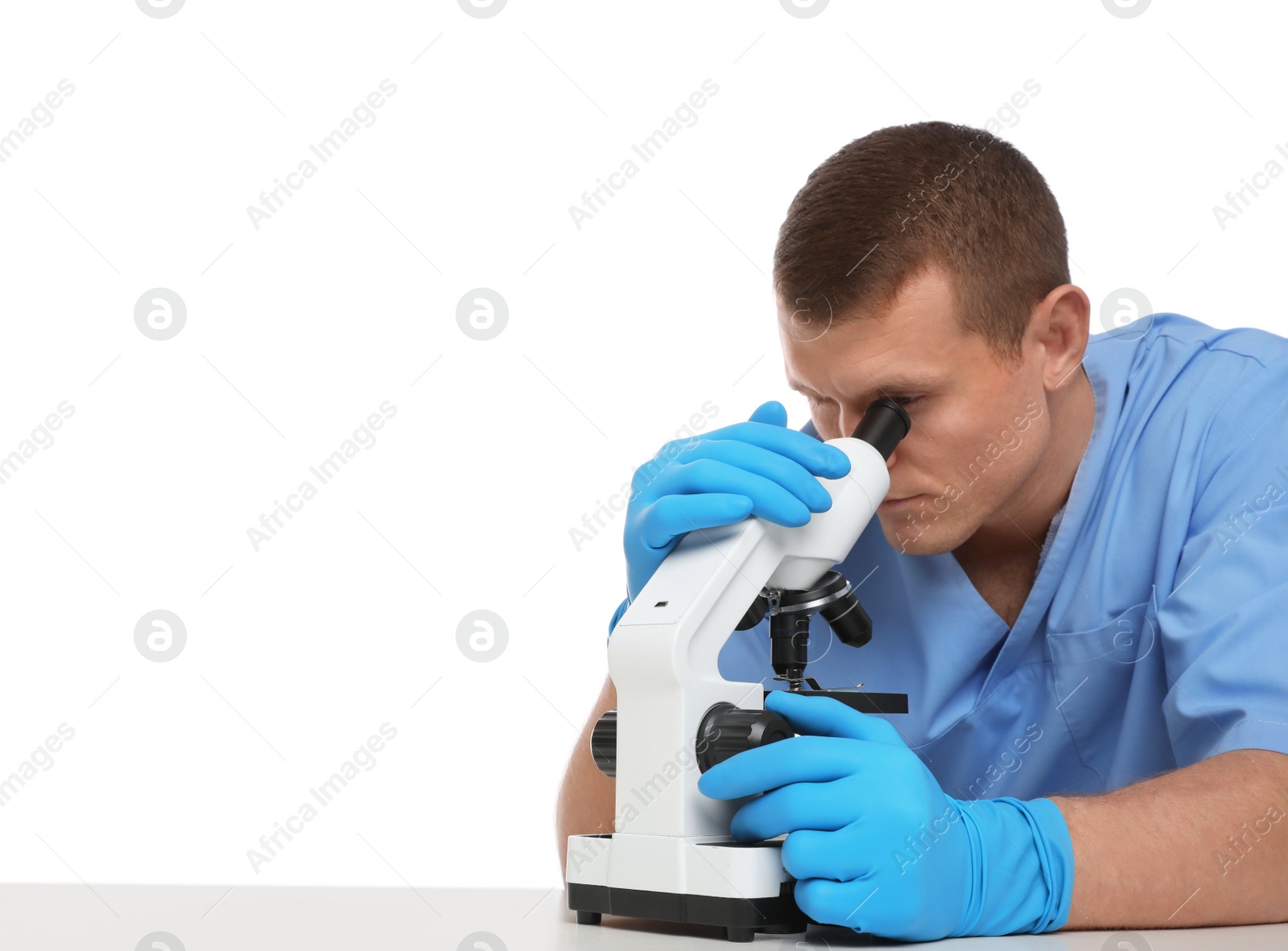 Photo of Scientist using modern microscope at table isolated on white. Medical research