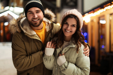 Lovely couple on city street. Winter vacation