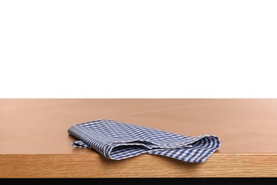 Checkered tablecloth on wooden table against white background